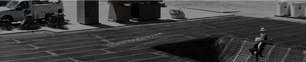 image of a construcion worker sitting on a roof